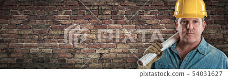 Male Contractor In Hard Hat Holding Construction Male Contractor In Hard Hat Holding Construction 54031627
