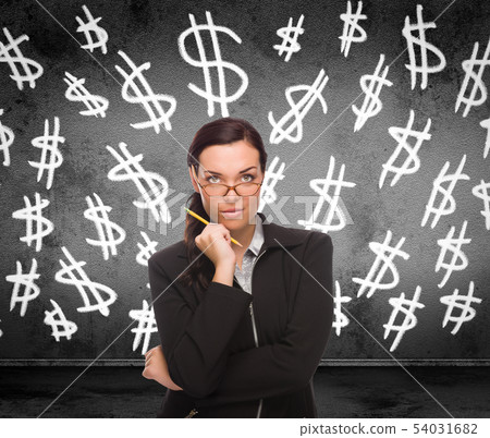 Dollar Signs Drawn on Wall Behind Young Adult 54031682