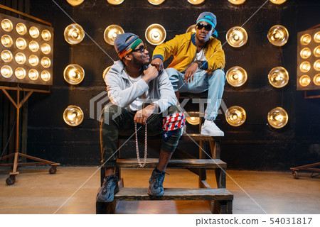 Black rappers in sunglasses, perfomance on stage Black rappers in sunglasses, perfomance on stage 54031817