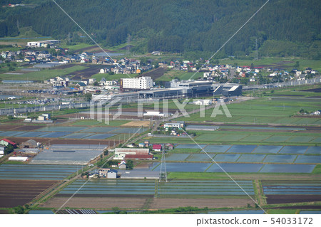 Taking a picture of the early summer scenery of Hokkaido Shinkansen Shin Hakodate Hokuto Station from Hokkaido Nanae Town Jyosu Skyline 54033172