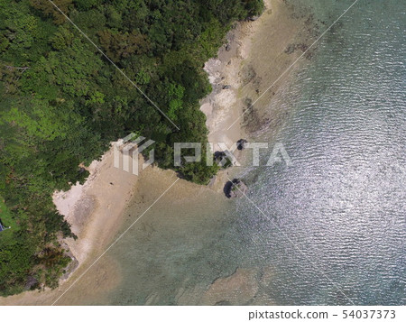Aerial view (during Okinawa Prefecture Uruma City) with the shore of a small island ~ drone 54037373