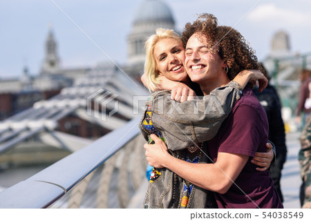 Happy couple hugging by Millennium bridge, River Happy couple hugging by Millennium bridge, River 54038549