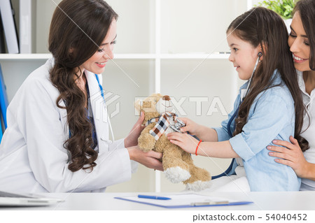 Mother and child at pediatrician office Mother and child at pediatrician office 54040452