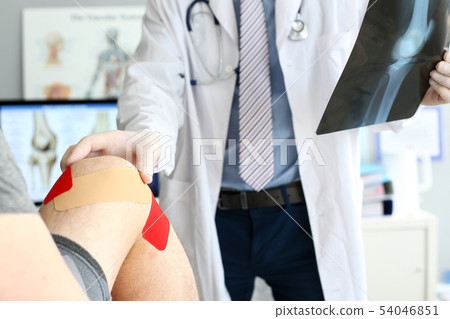 Doctor helping patient 54046851