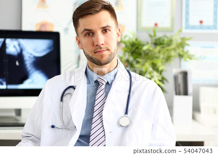 Young serious doctor Young serious doctor 54047043