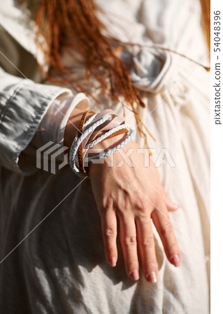 hand of fashionable girl dressed in white hand of fashionable girl dressed in white 54048396