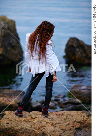 dreadlocks fashionable girl dressed in white dreadlocks fashionable girl dressed in white 54048440