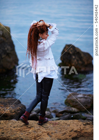 dreadlocks fashionable girl dressed in white 54048442