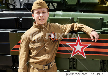 Boy dressed in Soviet military uniform during the Boy dressed in Soviet military uniform during the 54049148