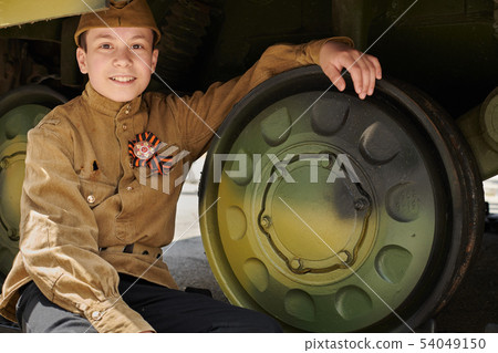 Boy dressed in Soviet military uniform during the Boy dressed in Soviet military uniform during the 54049150