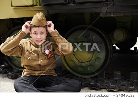 Boy dressed in Soviet military uniform during the Boy dressed in Soviet military uniform during the 54049152