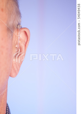 Man with hearing aid 54049438