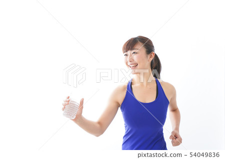 Women in sportswear taking fluid 54049836