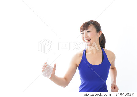 Women in sportswear taking fluid 54049837