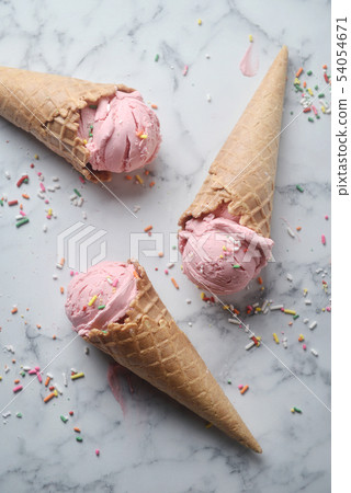 Delicious strawberry ice cream cone 54054671