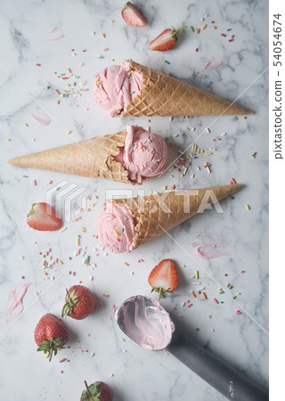 Delicious strawberry ice cream cone 54054674