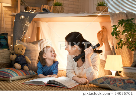 mother and daughter playing in tent mother and daughter playing in tent 54056701