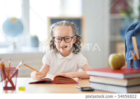 Kid is learning in class Kid is learning in class 54056822