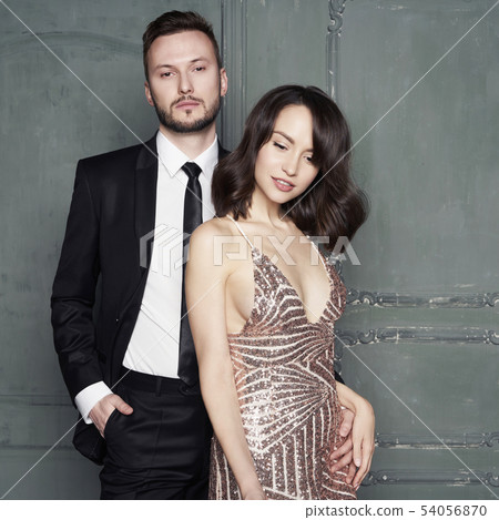 Glamour portrait of sexy young lovers. Fashionable Glamour portrait of sexy young lovers. Fashionable 54056870