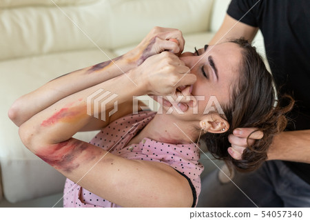 Victim, abuse and domestic violence - cruel man strangling his wife Victim, abuse and domestic violence - cruel man strangling his wife 54057340