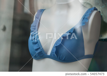 closeup of blue stripped bikini on mannequin  54057473