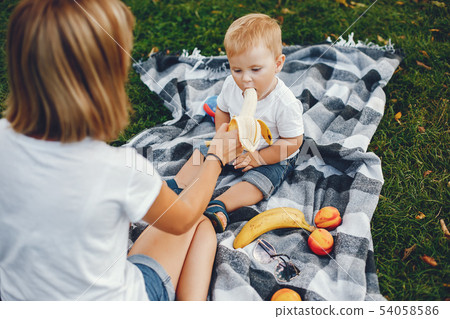 Mother with son playing in a summer park 54058586