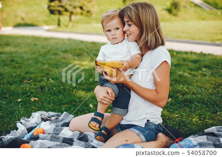 Mother with son playing in a summer park 54058700
