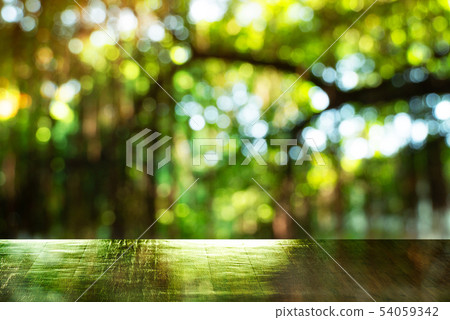 top of wood table with blur green summer light top of wood table with blur green summer light 54059342