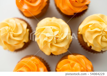 cupcakes with frosting on white background cupcakes with frosting on white background 54064229