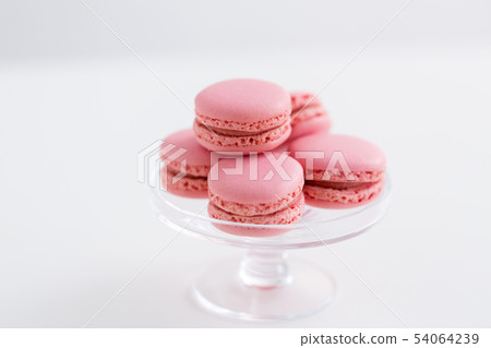 pink macarons on glass confectionery stand pink macarons on glass confectionery stand 54064239