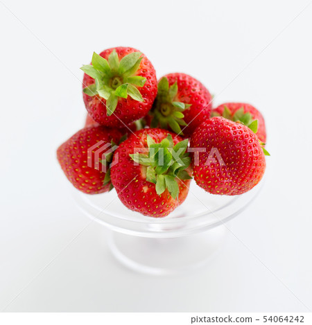 strawberries on glass stand over white background strawberries on glass stand over white background 54064242