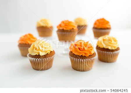 cupcakes with frosting on white background cupcakes with frosting on white background 54064245
