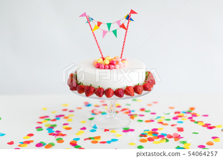 close up of birthday cake with garland on stand close up of birthday cake with garland on stand 54064257