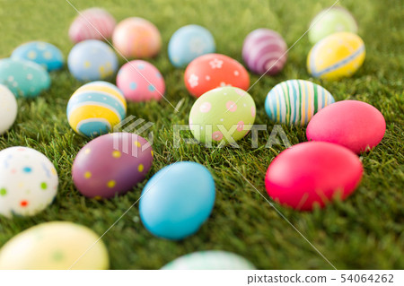 colored easter eggs on artificial grass colored easter eggs on artificial grass 54064262