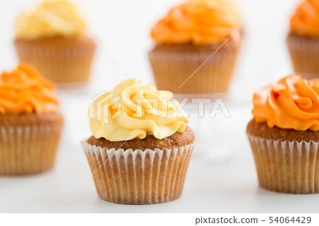 close up of cupcakes with buttercream frosting 54064429