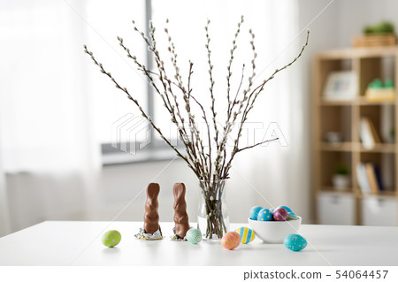 pussy willow, easter eggs and chocolate bunnies pussy willow, easter eggs and chocolate bunnies 54064457