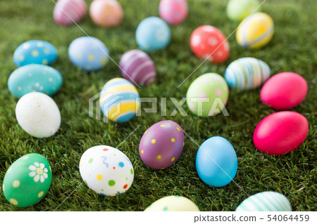 colored easter eggs on artificial grass colored easter eggs on artificial grass 54064459