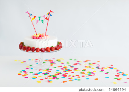 close up of birthday cake with garland on stand close up of birthday cake with garland on stand 54064594