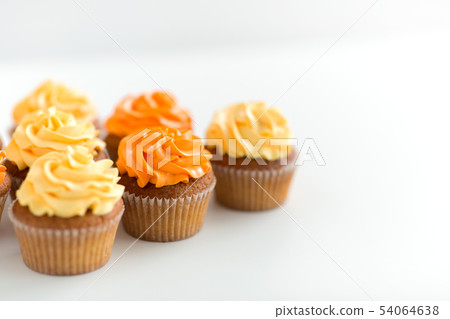 cupcakes with frosting on white background cupcakes with frosting on white background 54064638