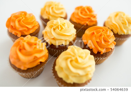cupcakes with frosting on white background cupcakes with frosting on white background 54064639