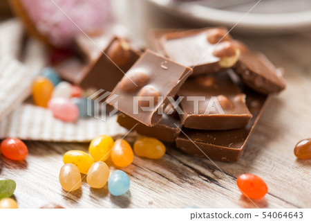 close up of drop candies and chocolate on table close up of drop candies and chocolate on table 54064643