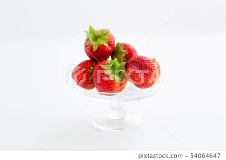 strawberries on glass stand over white background strawberries on glass stand over white background 54064647