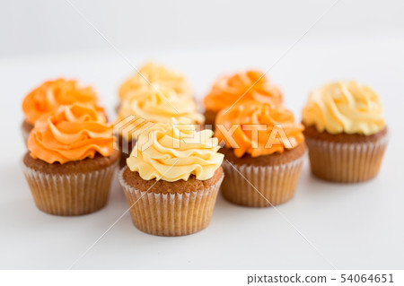 cupcakes with frosting on white background cupcakes with frosting on white background 54064651