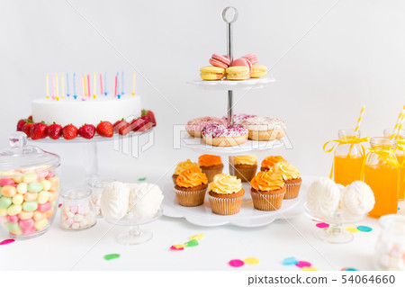 food and drinks on table at birthday party 54064660