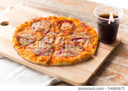 close up of homemade pizza with cola on table close up of homemade pizza with cola on table 54064671