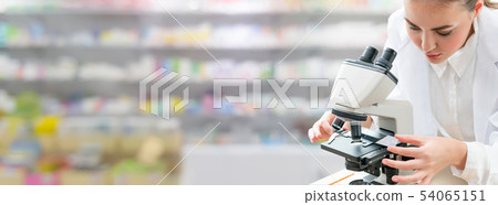 Scientist researcher uses microscope in laboratory Scientist researcher uses microscope in laboratory 54065151