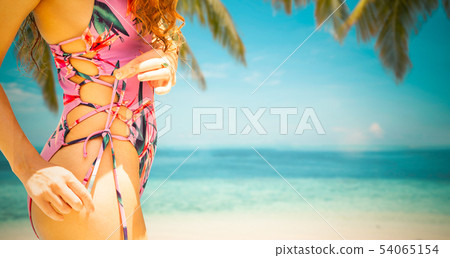 Happy young woman at beach in summer vacation. 54065154