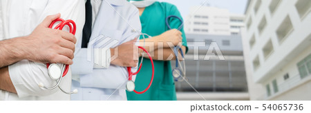 Doctor working in hospital with other doctors. Doctor working in hospital with other doctors. 54065736