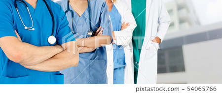 Doctor working in hospital with other doctors. Doctor working in hospital with other doctors. 54065766