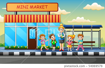 A women teacher and children waiting for the bus A women teacher and children waiting for the bus 54069578